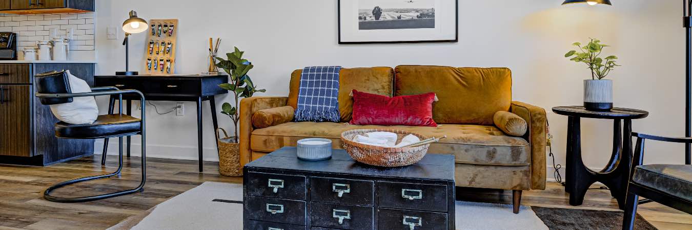 Apartment living room with a small desk next to the sofa