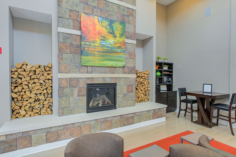 Your apartment maintenance team keeps everything in working order in both your apartment and common areas like this clubhouse at One One Six Apartments. Fireplace at an outdoor hangout area located at One One Six Apartments.