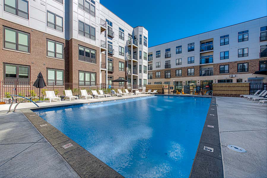 Close gates and only let in your own guests to amenities like this pool. Outdoor swimming pool at apartment complex