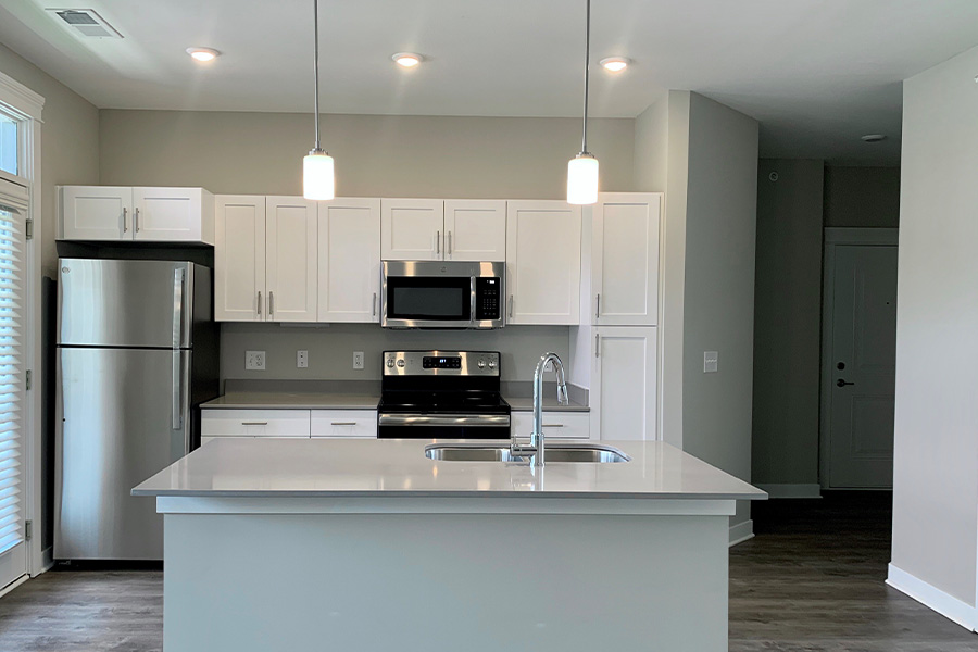 A deep clean will get your kitchen looking as nice as this one at Harmony Apartment Homes in Westfield. Apartment kitchen with stainless steel appliances and large island