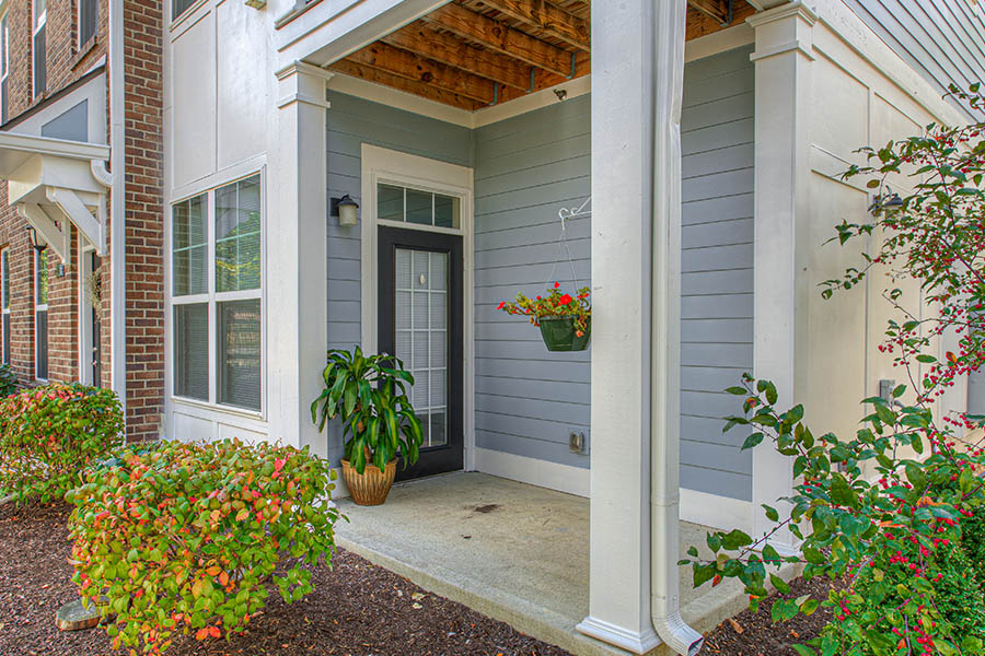 If you have an outside doorway like this one at Union Flats Apartments, you can liven it up with potted plants. Porch with potted plants located at Union Flats Apartments.
