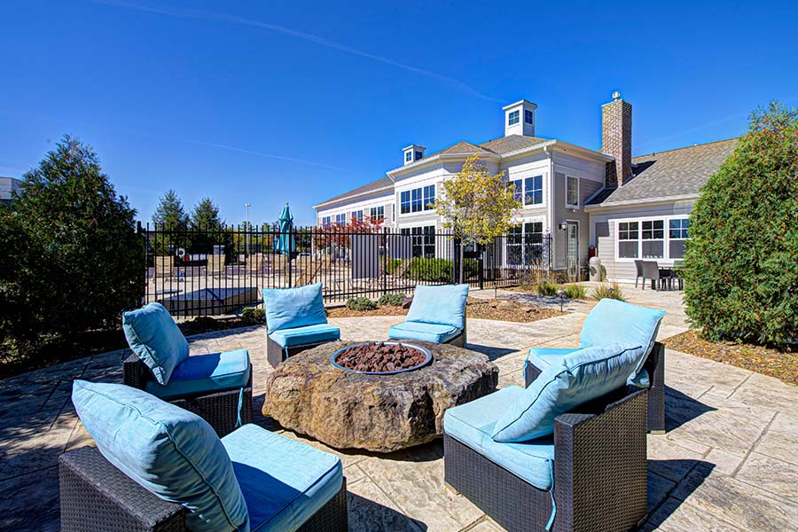 Seating area with fire pit at Lakeside Apartments of Carmel.