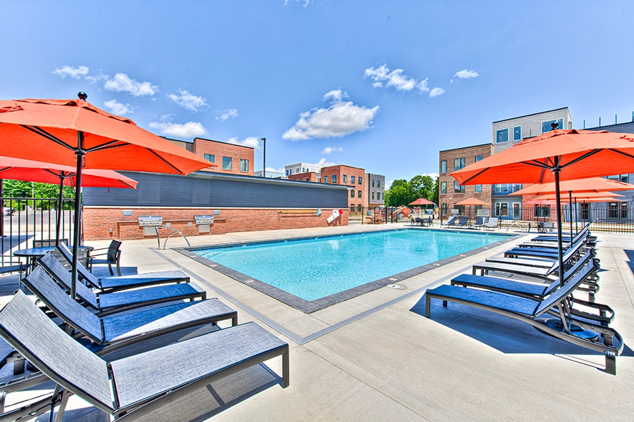 Swimming pool with lounge chairs at The Edge Apartments on Indy's North Side.